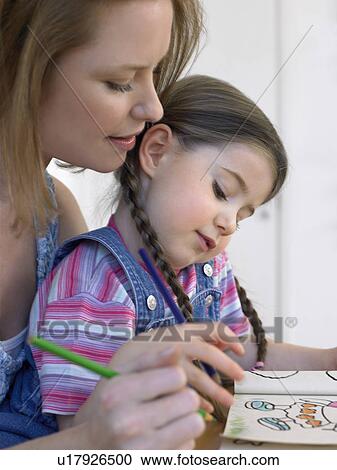 Mother and daughter (3-4) colouring in book at home View Large Photo Image Stock Image - Mother and daughter (3-4) colouring in book at home. Fotosearch