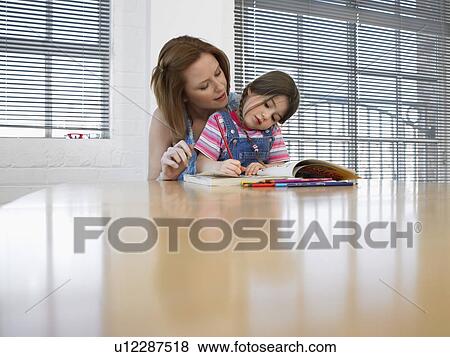 Mother and daughter (3-4) colouring in book at home View Large Photo Image Stock Photo - Mother and daughter (3-4) colouring in book at home. Fotosearch