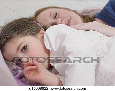 Mother Cuddling With Daughter View Large Photo Image Stock Image - Mother Cuddling With Daughter. Fotosearch