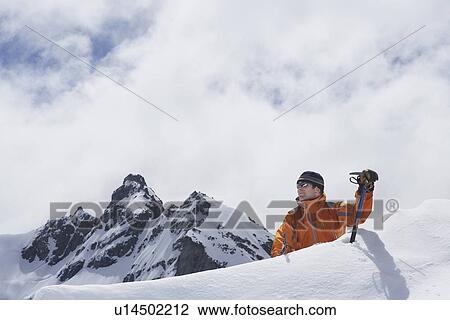Mountain climber coming over peak View Large Photo Image Stock Image - Mountain climber coming over peak. Fotosearch