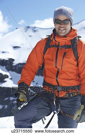 Mountain climber on top of peak View Large Photo Image Stock Image - Mountain climber on top of peak. Fotosearch