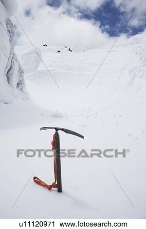 Mountain climbing pick axe in the snow View Large Photo Image Stock Image - Mountain climbing pick axe in the snow. Fotosearch