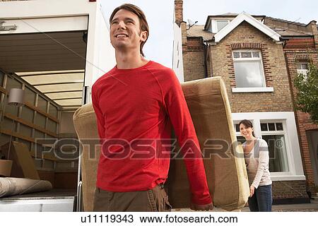 Moving Couple Carrying Sofa View Large Photo Image Stock Image - Moving Couple Carrying Sofa. Fotosearch