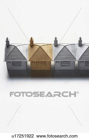 One gold model house in row of grey ones View Large Photo Image Stock Image - One gold model house in row of grey ones. Fotosearch