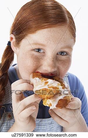 Overweight girl (13-15) Eating pastry portrait close-up View Large Photo Image Stock Photo - Overweight girl (13-15) Eating pastry portrait close-up. Fotosearch