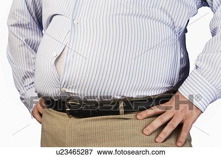Overweight Man standing with unbuttoned shirt hands on hip mid section View Large Photo Image Stock Photo - Overweight Man standing with unbuttoned shirt hands on hip mid section. Fotosearch