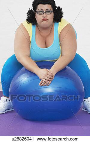 Overweight Woman sitting on Exercise Ball portrait View Large Photo Image Stock Image - Overweight Woman sitting on Exercise Ball portrait. Fotosearch