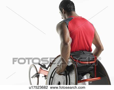 Stock Image - Paraplegic cycler back view. Fotosearch