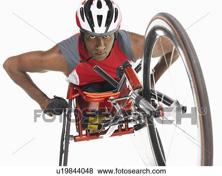 Stock Photo - Paraplegic cycler low angle view. Fotosearch