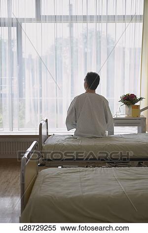Patient Sitting on Hospital Bed back view View Large Photo Image Stock Photography - Patient Sitting on Hospital Bed back view. Fotosearch