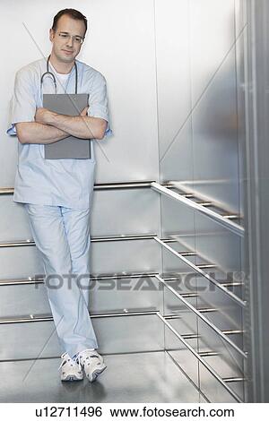 Physician Waiting in Elevator View Large Photo Image Stock Photograph - Physician Waiting in Elevator. Fotosearch