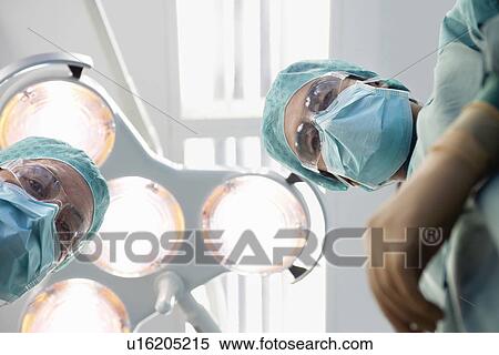 Physicians in operating theatre personal perspective View Large Photo Image Stock Photography - Physicians in operating theatre personal perspective. Fotosearch