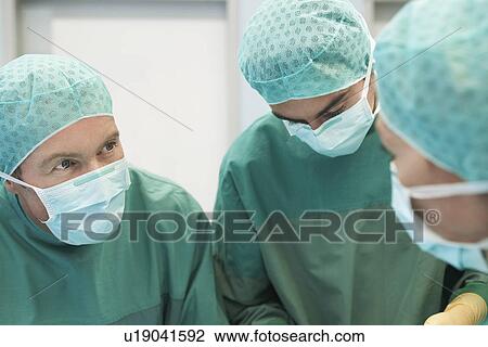 Physicians in Surgery operating on patient View Large Photo Image Stock Image - Physicians in Surgery operating on patient. Fotosearch