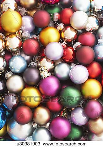 Stock Image - Pile of Christmas baubles full frame. Fotosearch