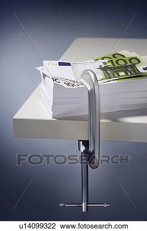 Pile of Euros clamped to table View Large Photo Image Stock Image - Pile of Euros clamped to table. Fotosearch