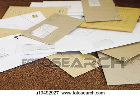 Stock Photo - Pile of mail on doormat. Fotosearch