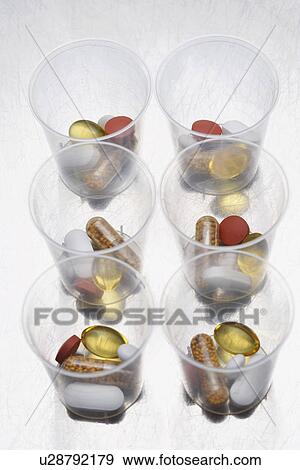 Pills and tablets in six plastic cups View Large Photo Image Stock Photo - Pills and tablets in six plastic cups. Fotosearch