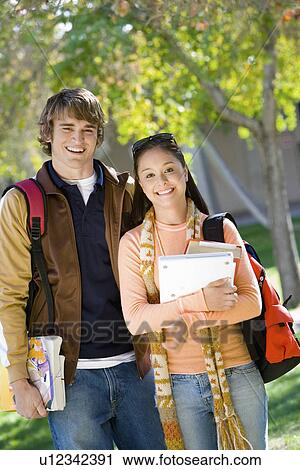 Portrait of two smiling college students outdoors View Large Photo Image Stock Image - Portrait of two smiling college students outdoors. Fotosearch