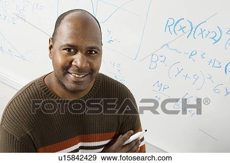 Professor by whiteboard with equations (portrait) View Large Photo Image Stock Photo - Professor by whiteboard with equations (portrait). Fotosearch