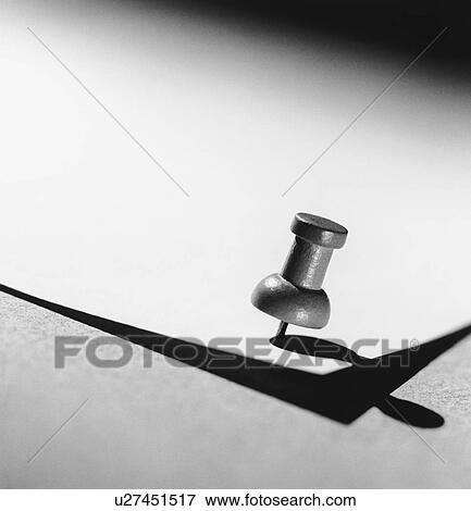 Push pin holding down paper (b&w) (close-up) View Large Photo Image Stock Photo - Push pin holding down paper (b&w) (close-up). Fotosearch