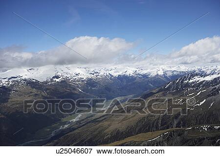 River running through mountain valley View Large Photo Image Stock Photo - River running through mountain valley. Fotosearch