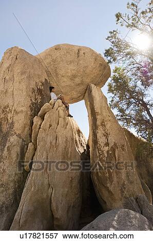 Rock formation in sunlight low angle view View Large Photo Image Stock Photo - Rock formation in sunlight low angle view. Fotosearch