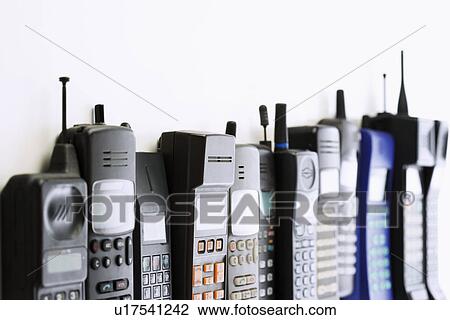 Stock Image - Row of mobile phones. Fotosearch