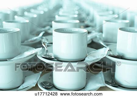Stock Photo - Rows of stacked teacups and saucers close-up.. Fotosearch