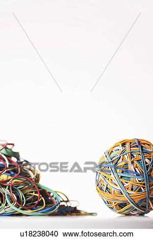 Rubber Band Ball by pile of rubber bands in studio View Large Photo Image Stock Image - Rubber Band Ball by pile of rubber bands in studio. Fotosearch