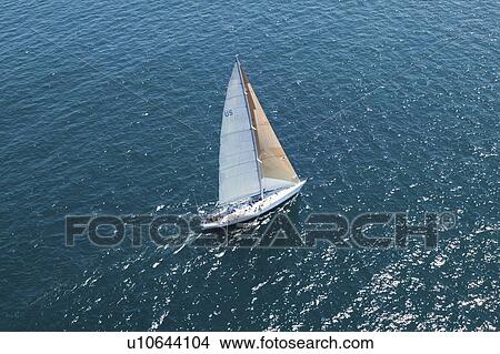 Sailboat on Ocean elevated view View Large Photo Image Picture - Sailboat on Ocean elevated view. Fotosearch