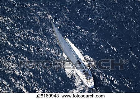 Sailboat on Ocean elevated view View Large Photo Image Stock Image - Sailboat on Ocean elevated view. Fotosearch