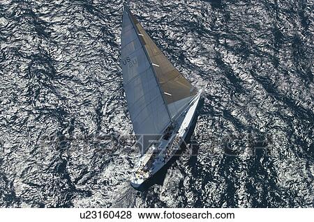 Sailboat on Ocean elevated view View Large Photo Image Stock Photo - Sailboat on Ocean elevated view. Fotosearch