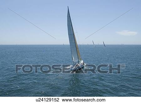 Sailboat racing on Ocean back view View Large Photo Image Stock Image - Sailboat racing on Ocean back view. Fotosearch