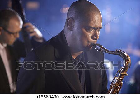Saxophone player on stage portrait View Large Photo Image Stock Image - Saxophone player on stage portrait. Fotosearch