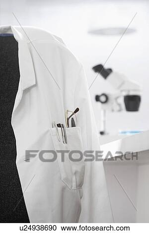Scientists white coat in laboratory with microscope in background View Large Photo Image Stock Image - Scientists white coat in laboratory with microscope in background. Fotosearch
