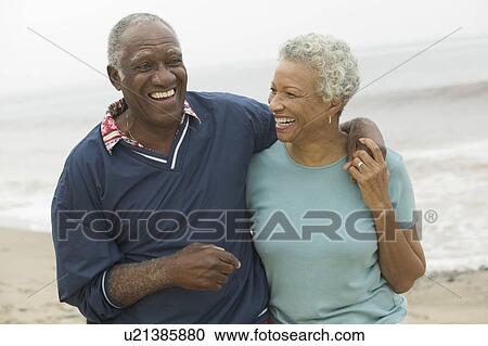 Senior couple embracing at beach View Large Photo Image Stock Image - Senior couple embracing at beach. Fotosearch