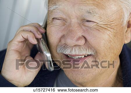 Senior man using mobile phone (close-up) View Large Photo Image Stock Photograph - Senior man using mobile phone (close-up). Fotosearch