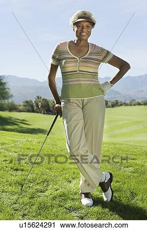 Senior woman on golf course (portrait) View Large Photo Image Stock Image - Senior woman on golf course (portrait). Fotosearch