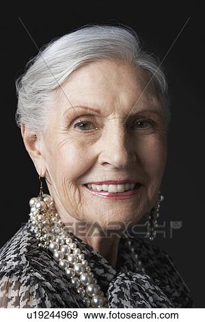 Senior Woman with Pearl Earrings View Large Photo Image Stock Photo - Senior Woman with Pearl Earrings. Fotosearch