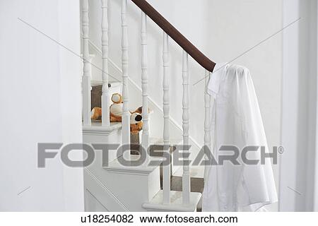 Shirt hanging on banisters View Large Photo Image Stock Image - Shirt hanging on banisters. Fotosearch