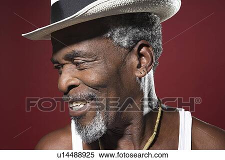 Stock Photography - Smiling Man Wearing Fedora. Fotosearch