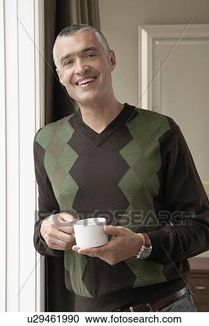 Smiling man with cup of coffee (portrait) View Large Photo Image Stock Image - Smiling man with cup of coffee (portrait). Fotosearch
