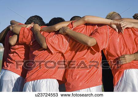Soccer team in huddle back view View Large Photo Image Stock Image - Soccer team in huddle back view. Fotosearch