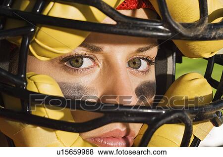 Softball player wearing helmet close-up of face View Large Photo Image Stock Photo - Softball player wearing helmet close-up of face. Fotosearch