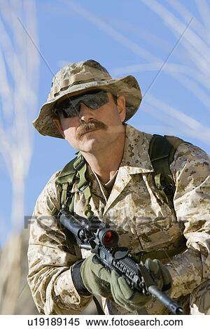 Soldier on patrol outdoors View Large Photo Image Stock Photography - Soldier on patrol outdoors. Fotosearch