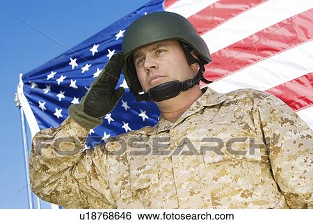 Soldier saluting in front of United States flag (portrait) View Large Photo Image Stock Photograph - Soldier saluting in front of United States flag (portrait). Fotosearch
