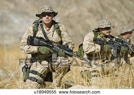 Soldiers with rifles in field View Large Photo Image Stock Photography - Soldiers with rifles in field. Fotosearch