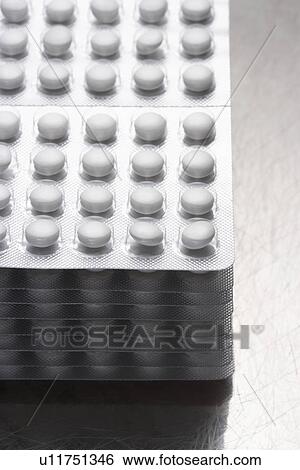 Stack of pills in packaging close-up View Large Photo Image Stock Photograph - Stack of pills in packaging close-up. Fotosearch