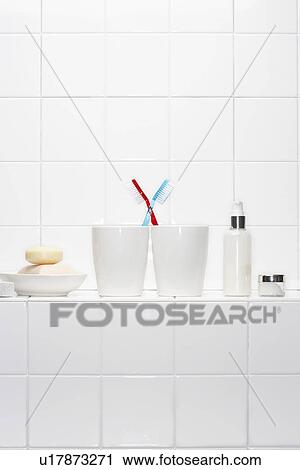 Still life of pair of toothbrushes conveying togetherness in white bathroom View Large Photo Image Stock Image - Still life of pair of toothbrushes conveying togetherness in white bathroom. Fotosearch