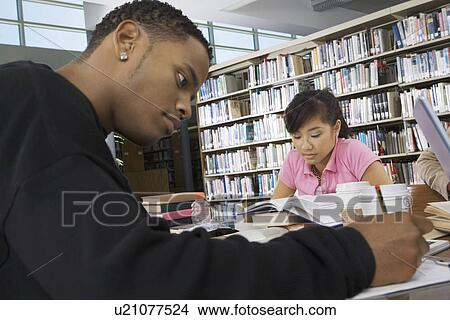 Students studying in college library View Large Photo Image Picture - Students studying in college library. Fotosearch